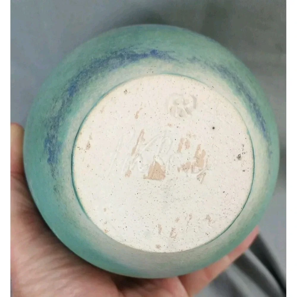 Ceramic Vase with a Blue-green Glaze and a Textured Surface.